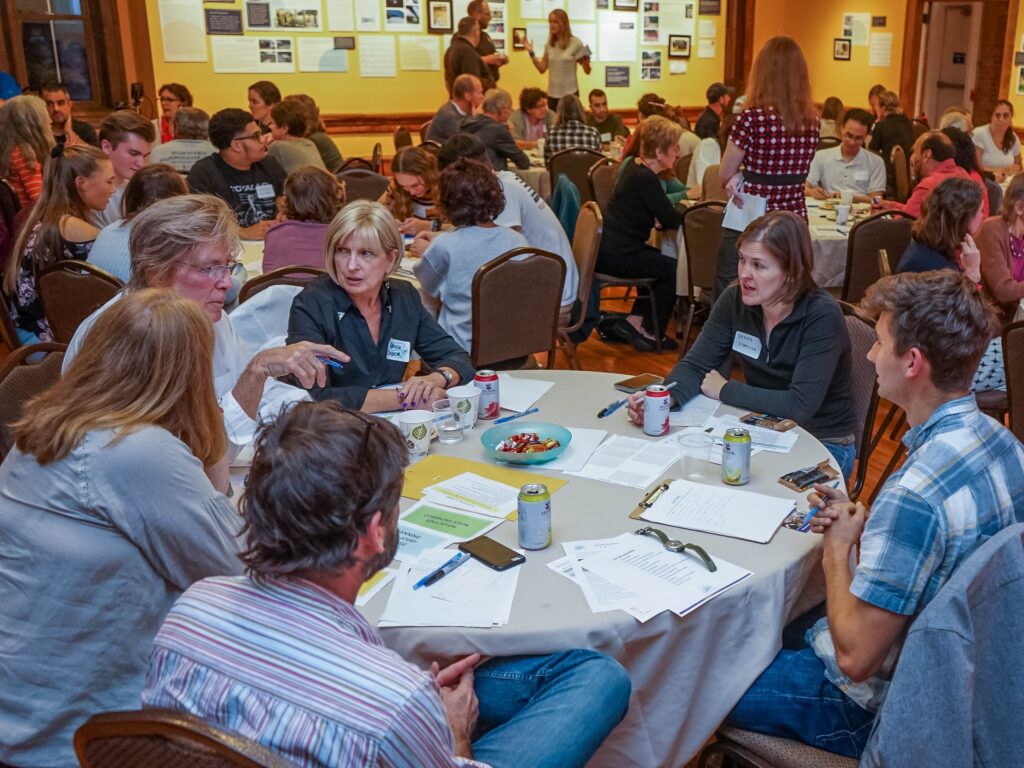 During a forum focused on developing a local vision for climate resilience, community members share their experiences with and priorities for addressing environmental hazards.